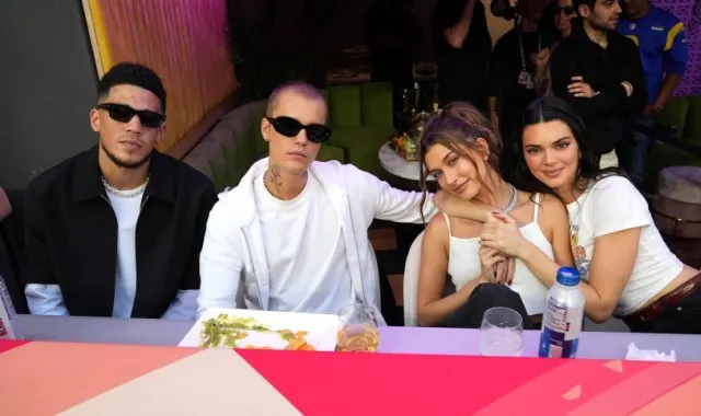 Kendall Jenner and her boyfriend, Devin Booker, book-end Justin Bieber and Hailey Baldwin.