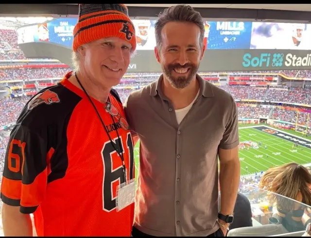 Funnymen Will Ferrell and Ryan Reynolds yuk it up at the game.
