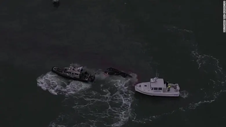 A woman’s 911 call saved three fishermen in boating incident