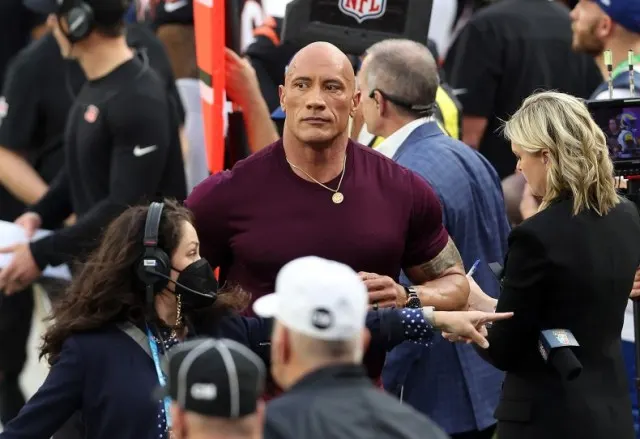 Dwayne "The Rock" Johnson in one of the rare settings where he's among men his size.