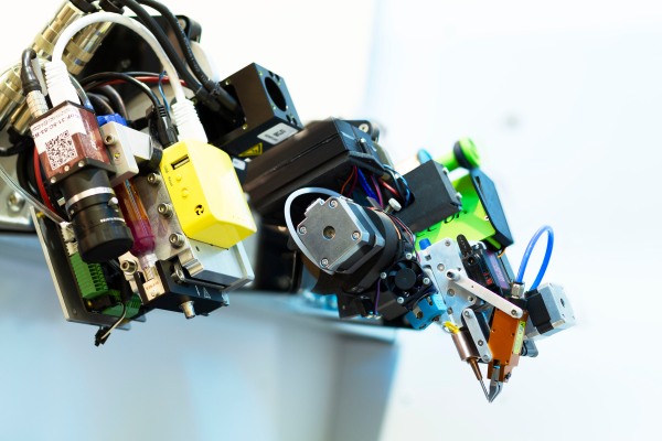 Q5D is using robots to automate electronic wiring during manufacturing