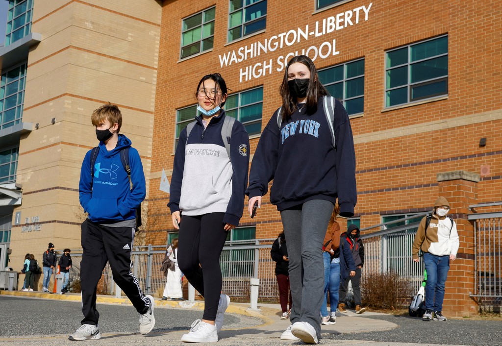 Students leave Washington-Liberty High School in Arlington County which is one of several school districts which sued to stop the mask-optional order by Governor Glenn Youngkin (R), in Arlington, Virginia, U.S., January 25, 2022