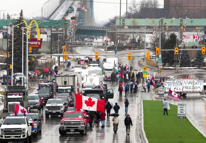 Truckers and supporters block the access leading from the Ambassador Bridge, linking Detroit and Windsor, as truckers and their supporters continue to protest against COVID-19 vaccine mandates and restrictions, in Windsor, Ontario on Friday.