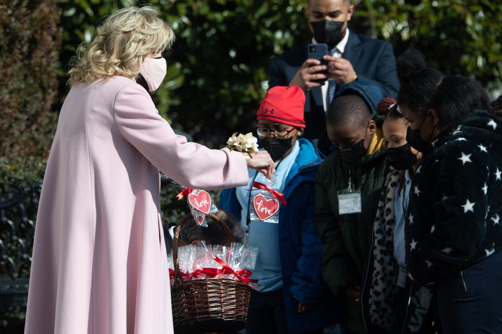 Biden handing out Valentine's Day cookies to the children.